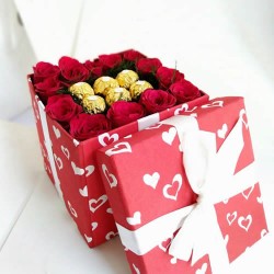 Red roses and ferrero rocher chocolates in gift box